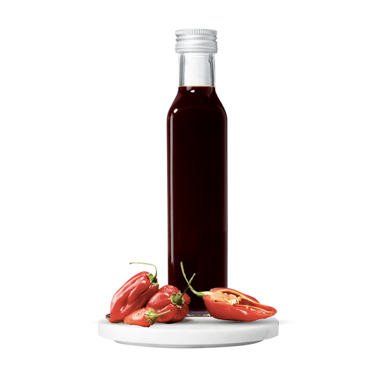 Bottle of balsamic with red peppers