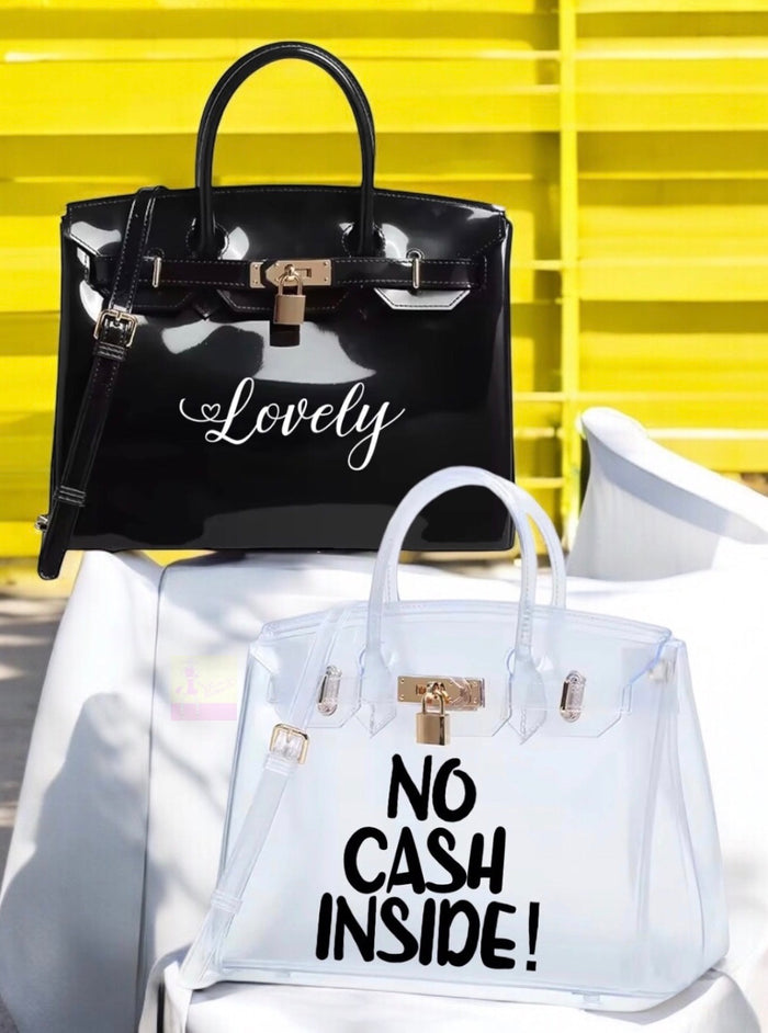 Personalized Beachkin tote bags in black and clear with custom text designs from Travellers Hat Boutique