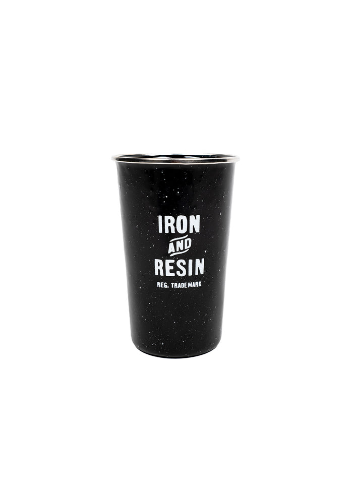 Black speckled enamel cup with "Iron and Resin" logo in white. Simple, rustic design on a plain white background.