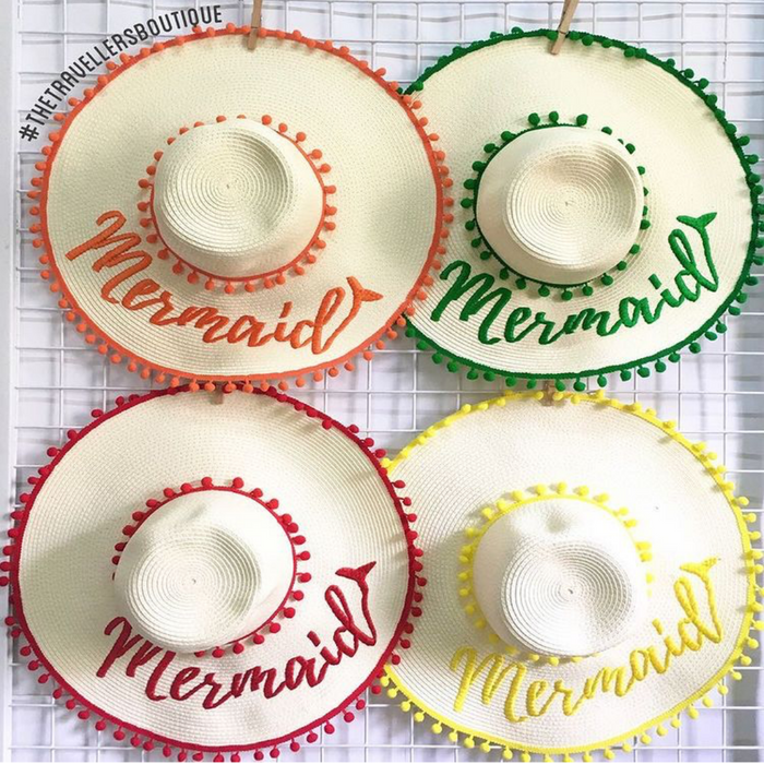 Travellers Hat Boutique custom floppy hat with pompoms in orange green red and yellow Mermaid embroidery