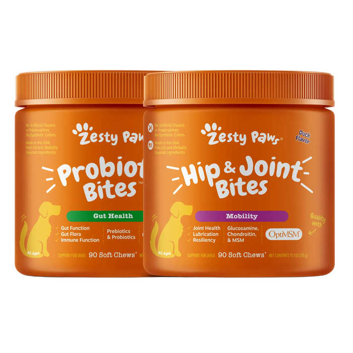 Two orange jars of Zesty Paws dog supplement on a white background