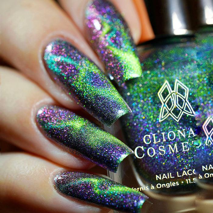 Close up of nails done with Psychonaut Nail Lacquer featuring a design to show off the magnetic effect on fair skin tone