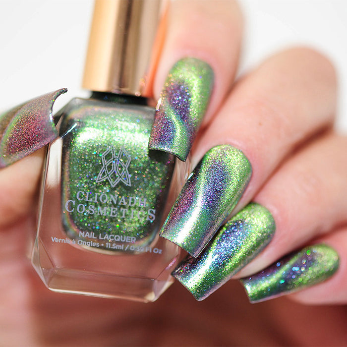 Close up of nails done with Psychonaut Nail Lacquer featuring a design to show off the magnetic effect  on fair skin tone.
