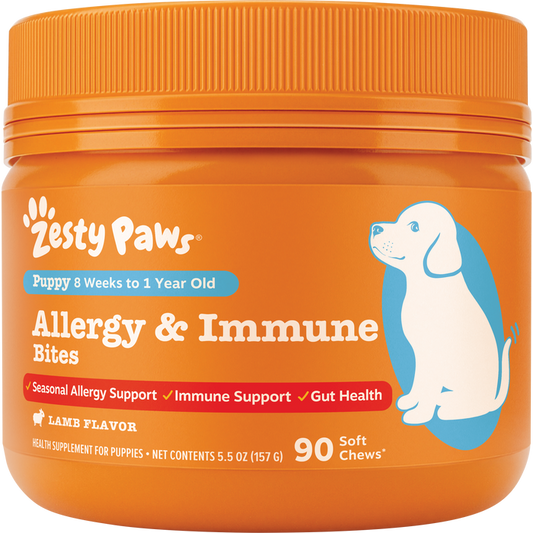 Orange jar of Zesty Paws puppy allergy and immune bites with blue illustration of a dog and orange ribbed cap.