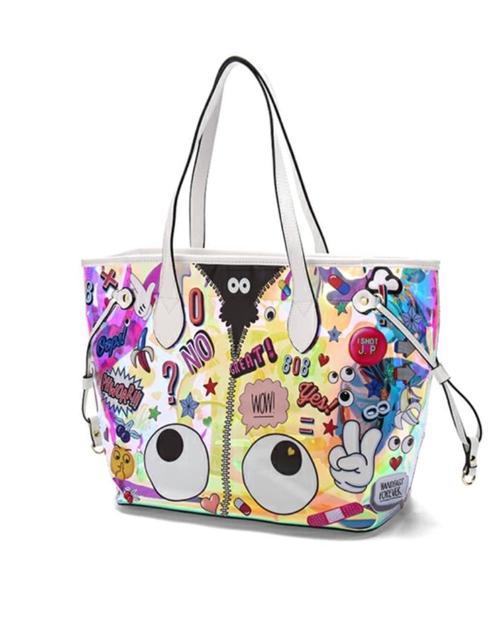 Holographic beach tote bag with colorful cartoon patches and white handles from Travellers Hat Boutique