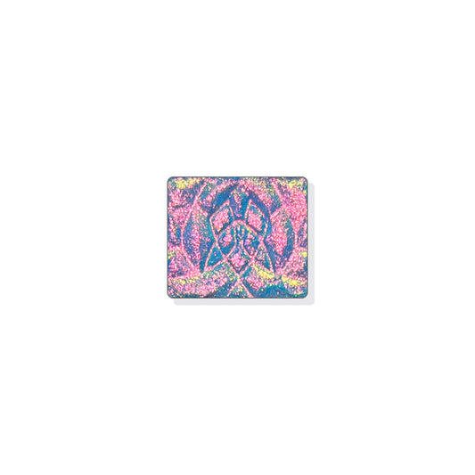 A single multichrome eyeshadow in colour Rex on a white background. A mid-toned blue base with large particles that shift pink-orange-yellow-lime.