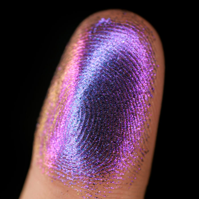 Macro finger swatch of Rosette Lite on fair skin tone.