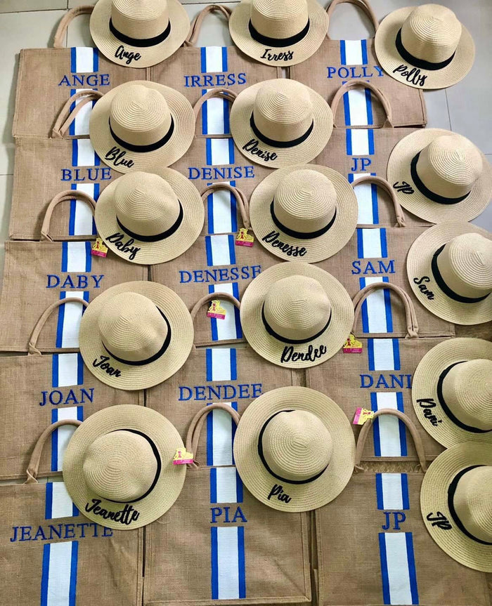 Custom embroidered round hat collection featuring natural straw color with black bands and personalized names