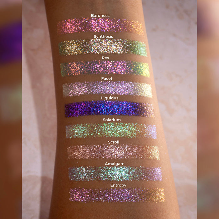 Arm swatches of the Halloween Stained Glass Expansion Bundle shadows on medium skin tone.