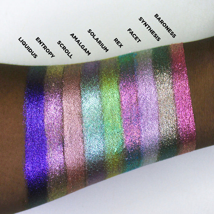 Arm swatches of the Halloween Stained Glass Expansion Bundle shadows on deep skin tone.