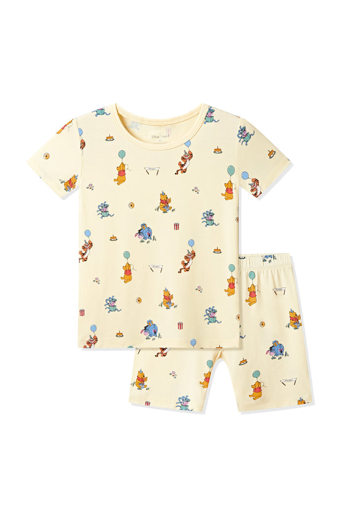 Short Sleeve Pajamas in Winnie the Pooh Celebration print on a white background