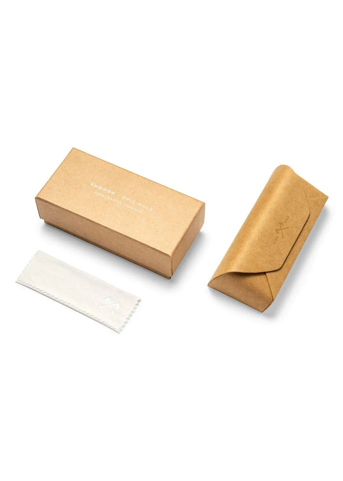 Brown cardboard box, matching case, and white cloth on white background, showcasing minimalist packaging design.