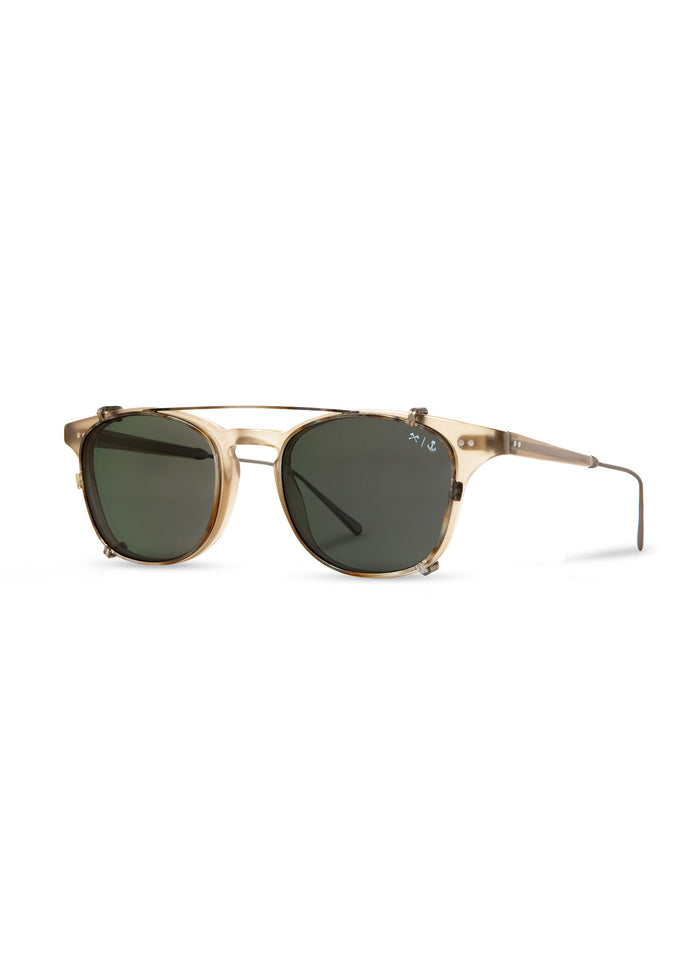Stylish sunglasses with round green lenses and a sleek gold frame, showcasing a modern and elegant design.