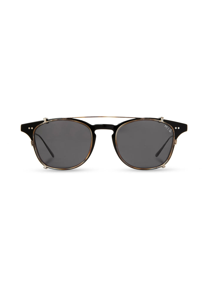 Black sunglasses with round lenses and gold accents on a white background. Simple, stylish design with a modern touch.