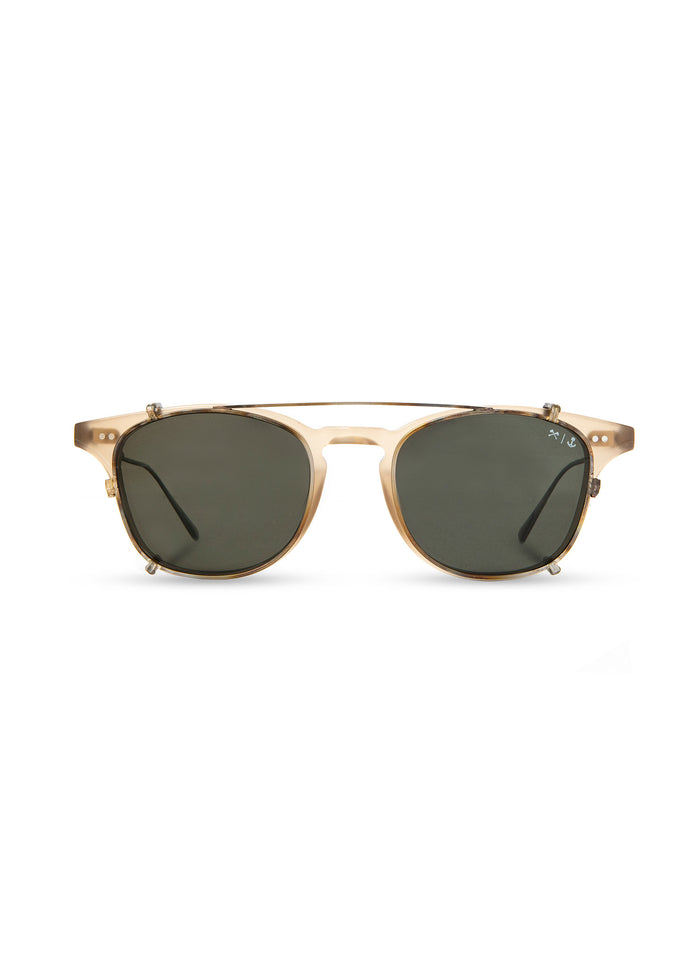 Stylish sunglasses with round green lenses and a sleek, transparent frame, displayed against a plain white background.