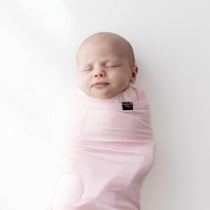 Baby asleep in Sleep Bag Swaddler in Sakura 0.5 close up