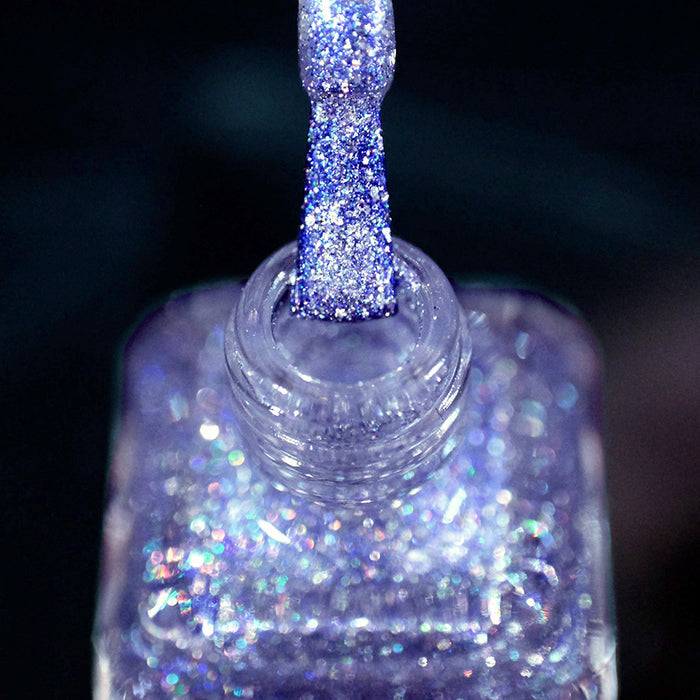 Close-up of nail polish bottle and brush showing product Spilled Salt Nail Lacquer.