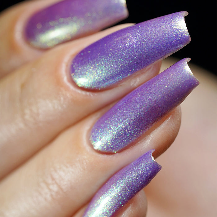 Close-up of nails painted with Royalty Nail Lacquer on fair skin tone.