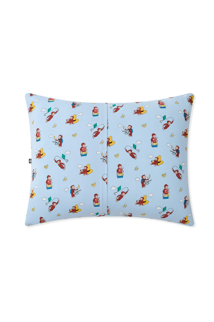 Back side of Blue Standard Pillowcase in Curious George print on a white background