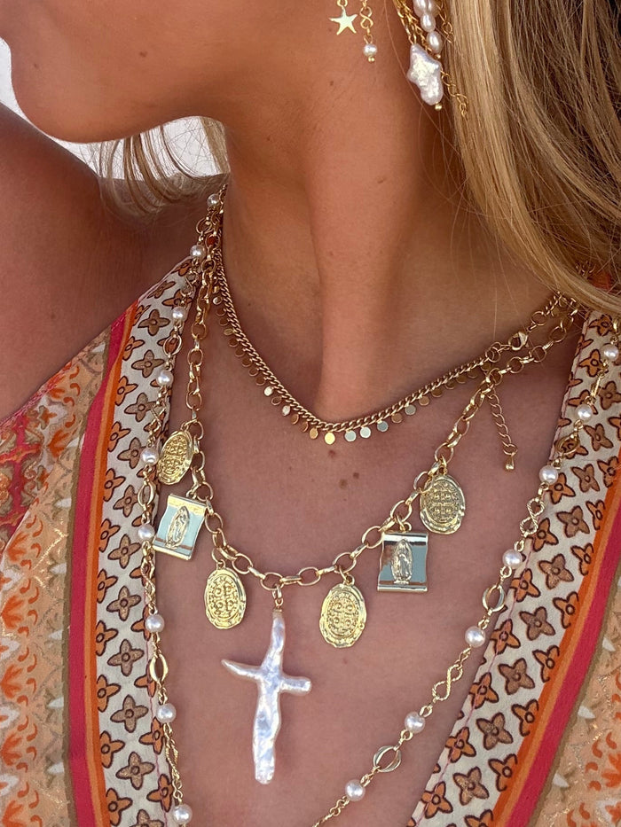 Layered chunky gold necklaces styled for everyday jewellery stack