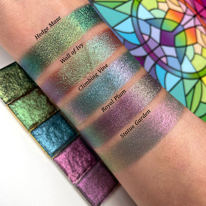 Top angled arm swatches on fair skin tone of Statue Garden Earth Vibrant Multichrome eyeshadow shifts compared to Hedge Maze, Wall of Ivy, Climbing Vine and Royal Plum