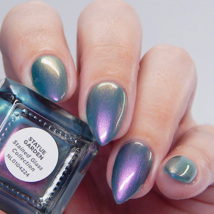 Close up shot of nails done with Statue Garden Nail Lacquer on fair skin tone.