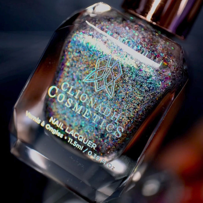 Angled, close-up of Step on a Crack Nail Lacquer bottle, on a blurred background.