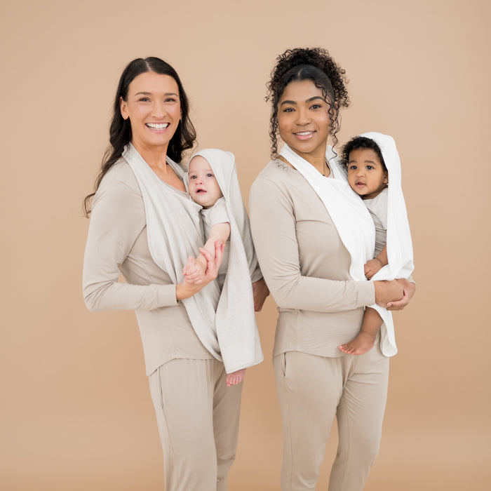 Mothers using Terry Apron Towels to wrap their babies after bathtime