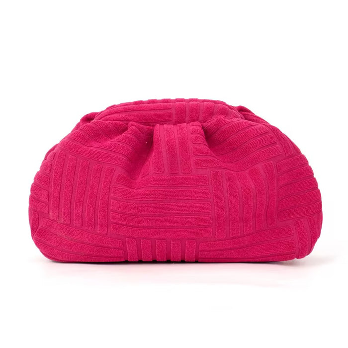 Pink textured clutch bag from Travellers Hat Boutique with soft fabric and ruched design
