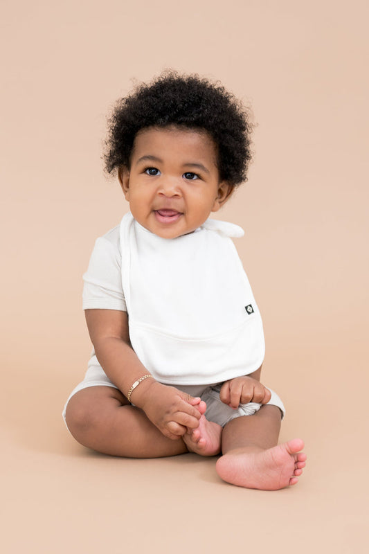 Baby wearing Terry Pocket Bib in Cloud