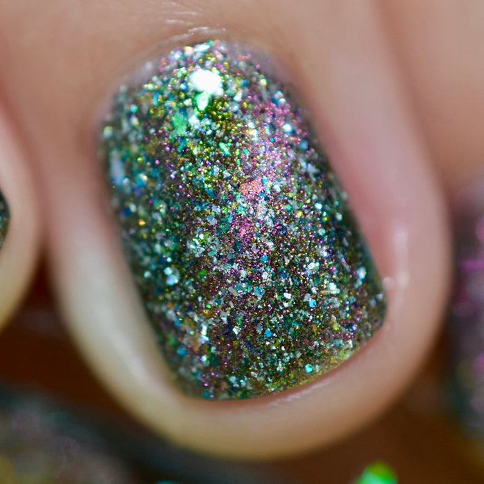 Close-up of one nail painted with Th1rt3en Nail Lacquer on fair skin tone.