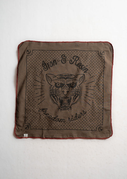 Brown bandana with "Iron & Resin" and "freedom riders" text, featuring a fierce tiger face design, bordered with red stitching.