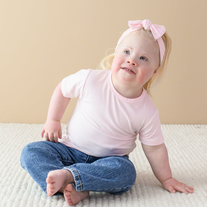 Toddler wearing Bamboo Basic Tee in Sakura with bow