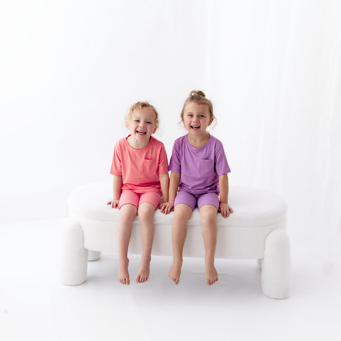 Kids wearing Toddler Crew Neck Tees in Guava and Poi with matching ribbed shorts
