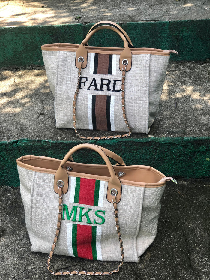 Travellers Hat Boutique custom monogram tote bag featuring beige fabric and personalized embroidered initials