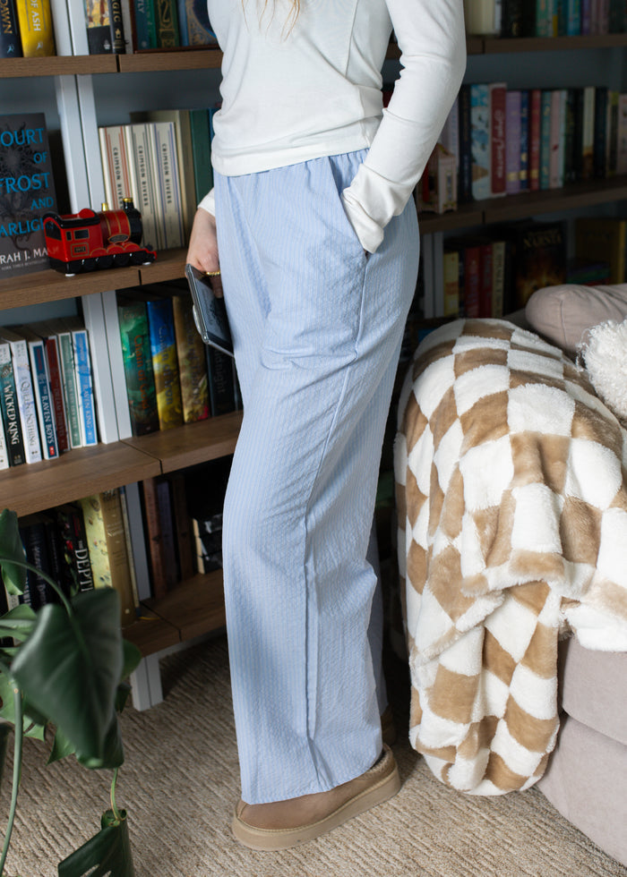 turning pages pants in light blue
