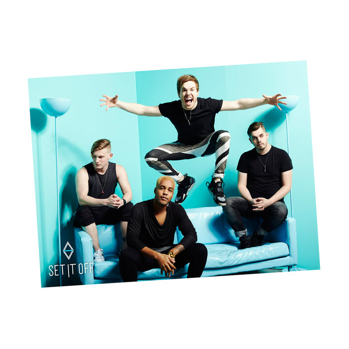 The poster has an image of the four men of set it off sitting on a bright blue couch in front of a blue wall. One of the men is jumping up from the couch with his arms out and his mouth wide open.