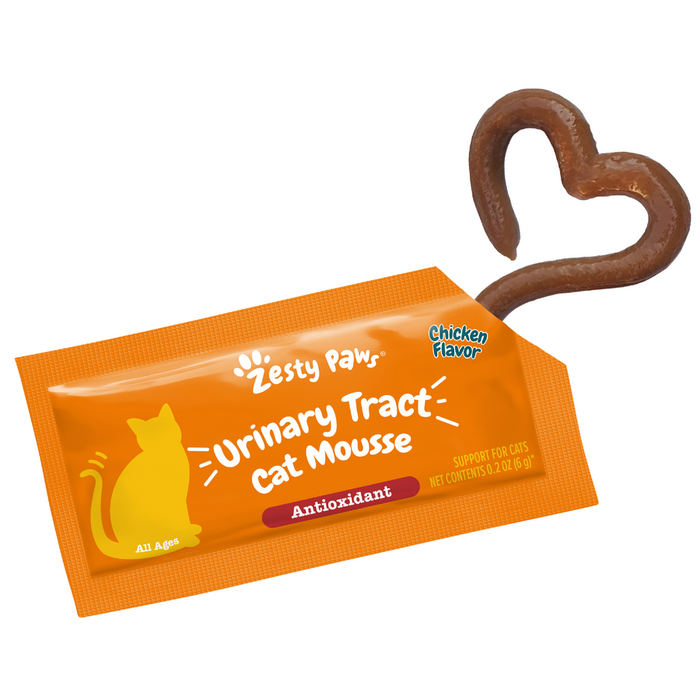 Orange packet of Zesty Paw Urinary Tract Cat Mousse with chicken flavor and brown mousse shaped like a heart above.