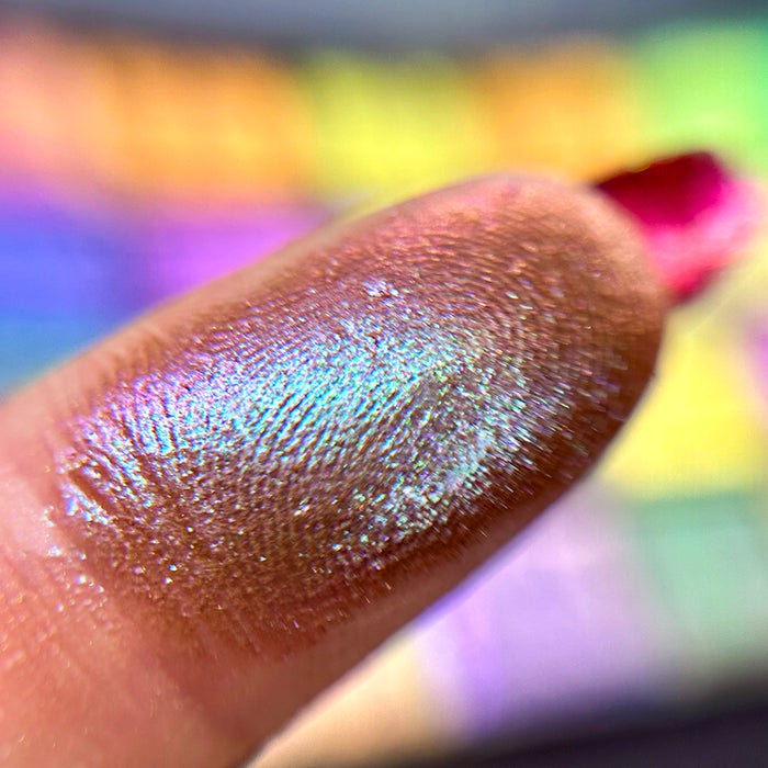 Macro finger swatch of Vault Glitter Multichrome Eyeshadow.