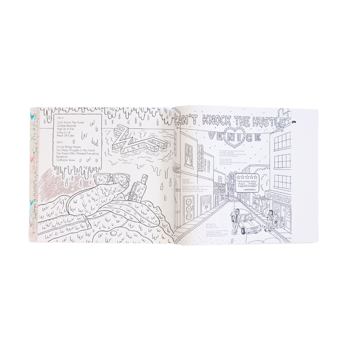 Open coloring book featuring black-and-white line art of a street scene with buildings, cars, and people.
