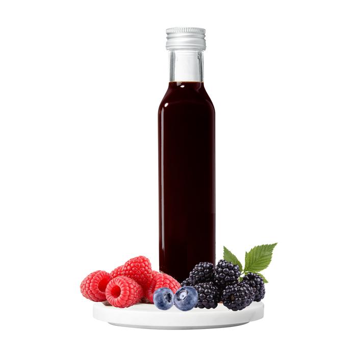 Bottle of vinegar with berries