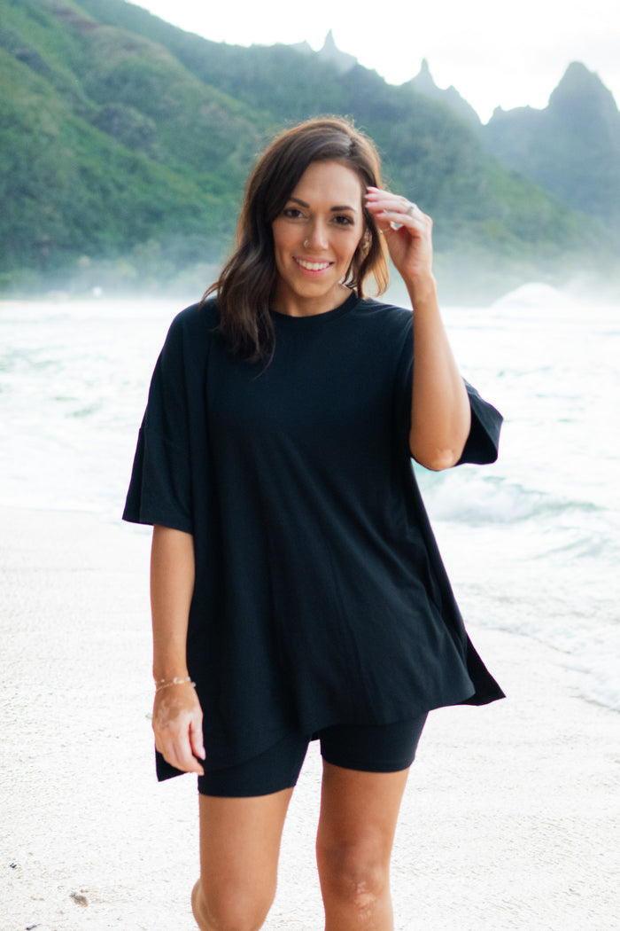Woman modeling Women’s Biker Short Set in Midnight on the beach