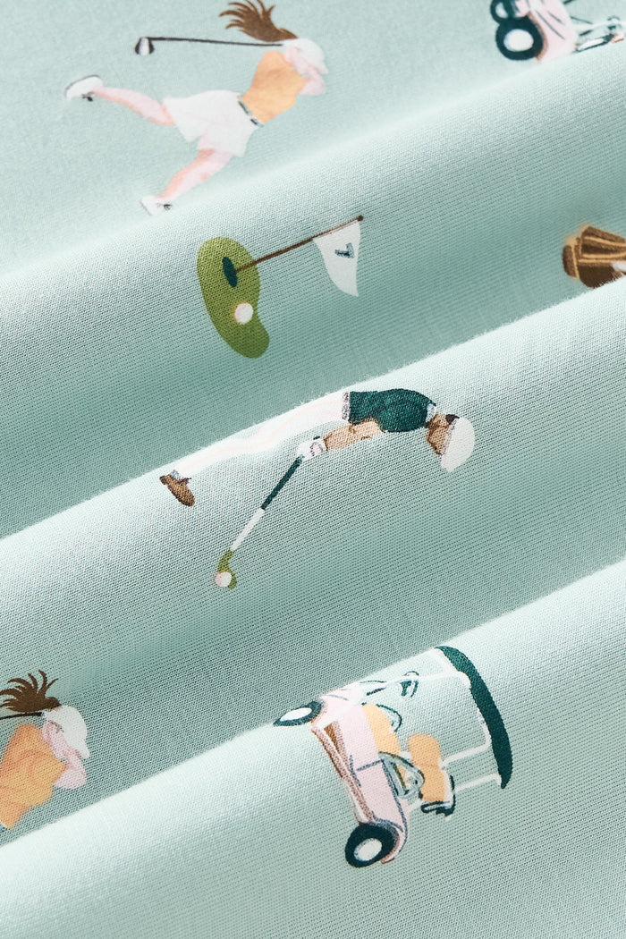 Close up of green fabric with golf pattern