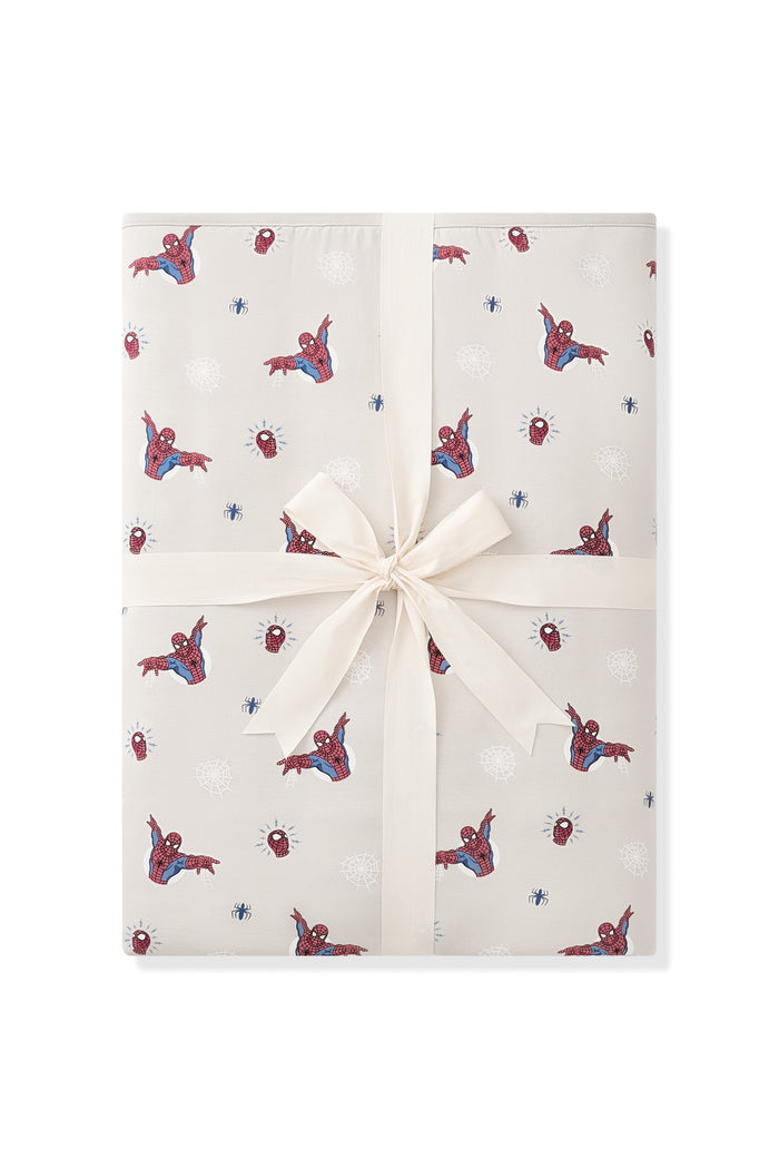 Oat Youth Blanket with Spider-Man 2.5 print packed with ribbon on a white background