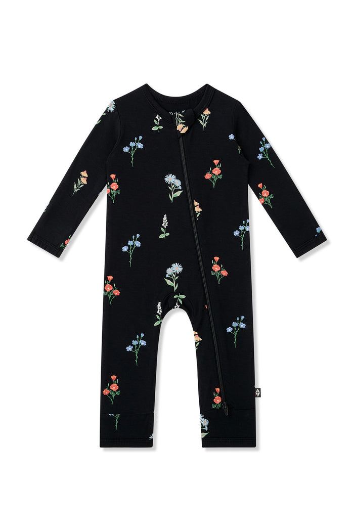Black Zippered Romper in Wildflower print on a white background