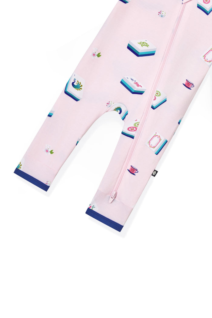 Bottom part of Pink Zippered Romper with Mahjong pattern on a white background