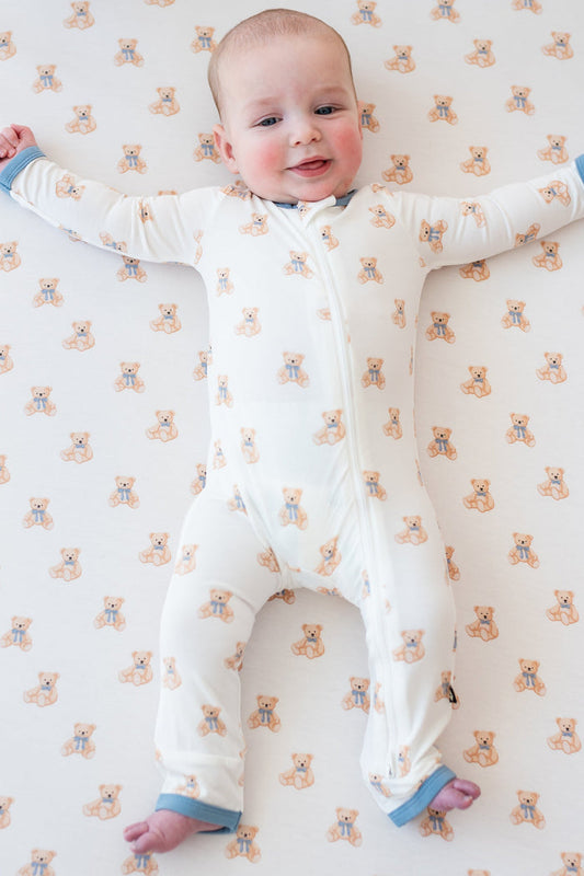 Baby wearing Zippered Romper in Teddy Bear in crib